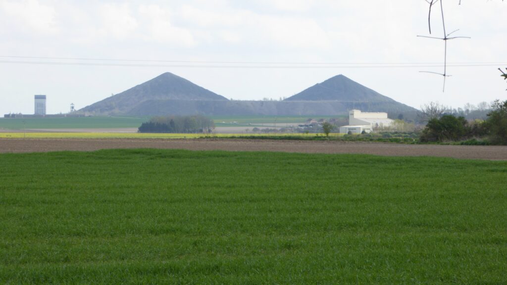 Two slag heaps in the distance.