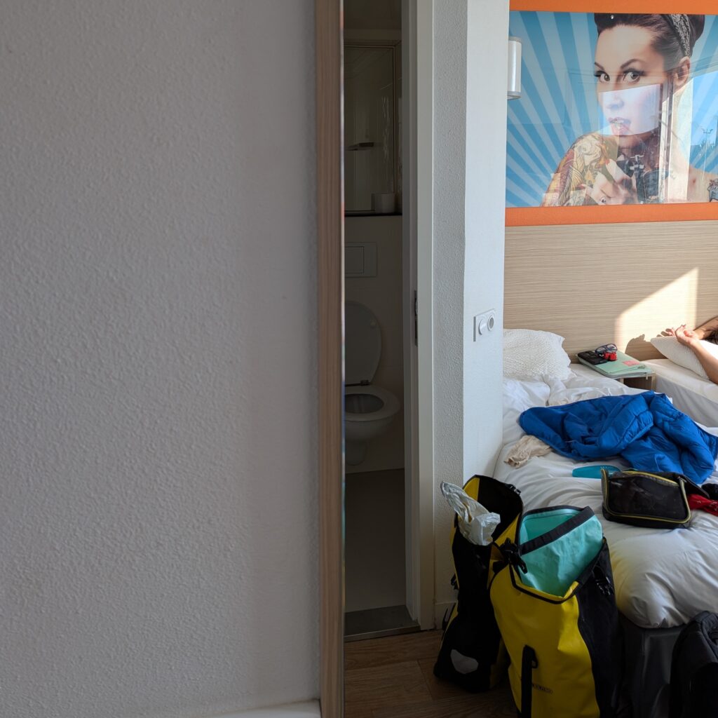 Sleeping in a messy hotel room.